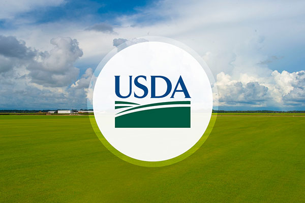 USDA logo over farm field