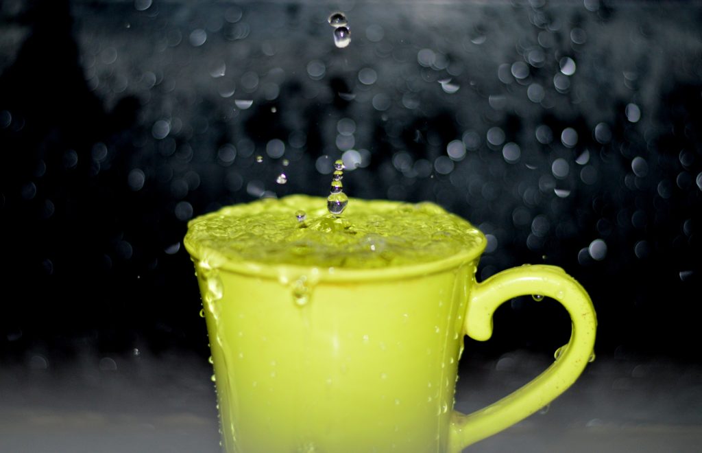 mug with water dropping into it